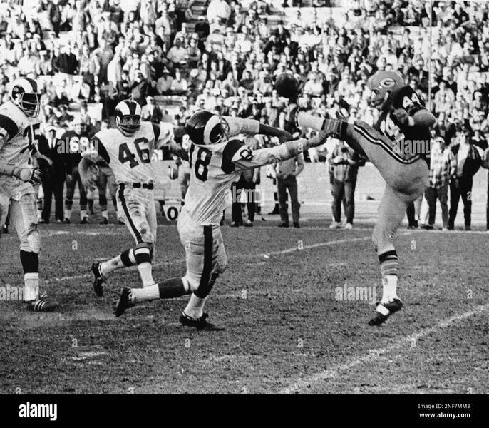 linebacker-tony-guillory-88-of-the-los-angeles-rams-blocks-a-punt-by-donny-anderson-of-the-green-bay-packers-in-the-final-minuted-of-their-game-in-los-angeles-on-dec-9-1967-claude-crabb-of-the-rams-bot-shown-picked-up-the-ball-and-ran-it-to-the-five-yard-line-from-where-the-rams-scored-two-plays-later-to-win-27-24-and-keep-their-hopes-alive-for-the-championship-of-the-coastal-division-of-the-national-league-other-rams-sown-are-dave-jones-975-and-willie-daniel-46-ap-photo-2NF7MM3.jpg