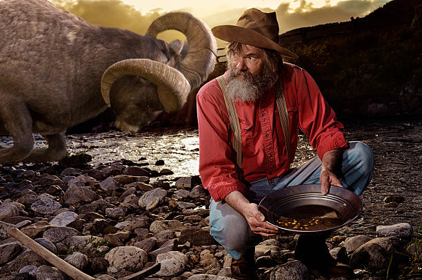 Old-Prospector-Panning-for-gold-Liquid-gold-from-the-sun-pouring-in-over-his-shoulder-from-a-hot-wes.jpg