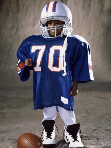 boy-in-an-oversized-football-uniform-wearing-a-helmet_a-G-4021956-14258389.jpg