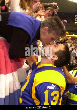 st-louis-rams-quarterback-kurt-warner-kisses-his-wife-brenda-after-the-rams-defeated-the-minnesota-vikings-49-37-in-the-nfc-divisional-playoff-game-at-the-trans-world-dome-january-16-warner-competed-27-of-33-passes-for-390-yards-with-five-touchdowns-and-one-interception-the-rams-will-host-the-nfc-championship-game-against-tampa-bay-january-23-jm-2d56a4c.jpg