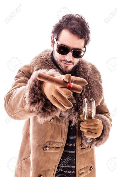 31452211-a-young-man-wearing-a-sheepskin-coat-isolated-over-a-white-background-holding-a-cigar-and-a-glass-wi.jpg