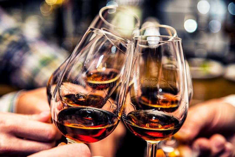cheers-group-friends-toast-to-cognac-brandy-40408030.jpg